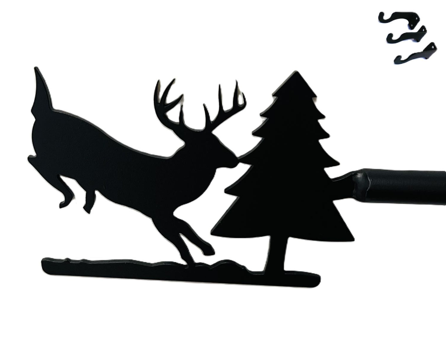 Close-up of deer and pine design on curtain rod