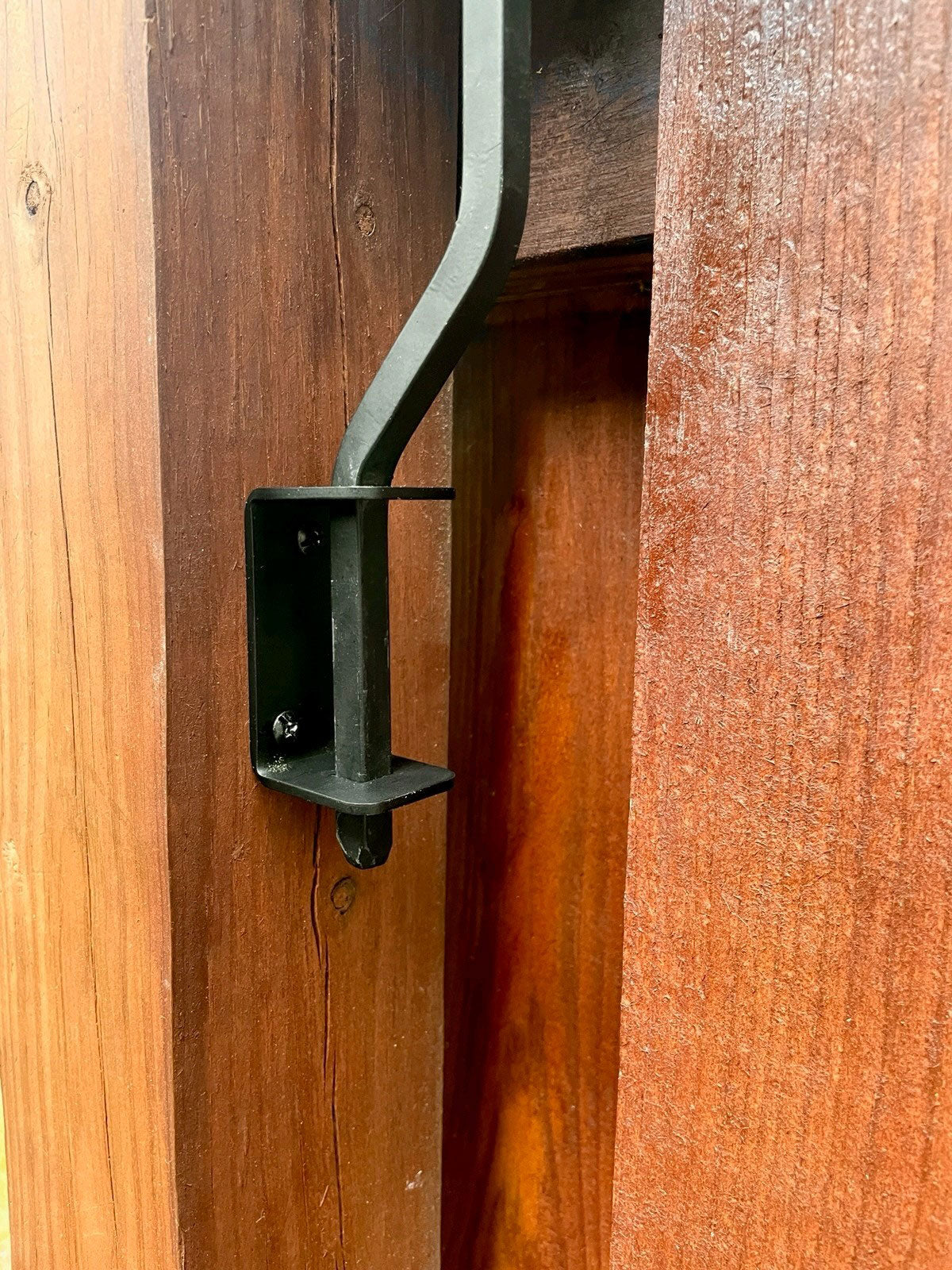 Lawn hook securely attached to wooden deck