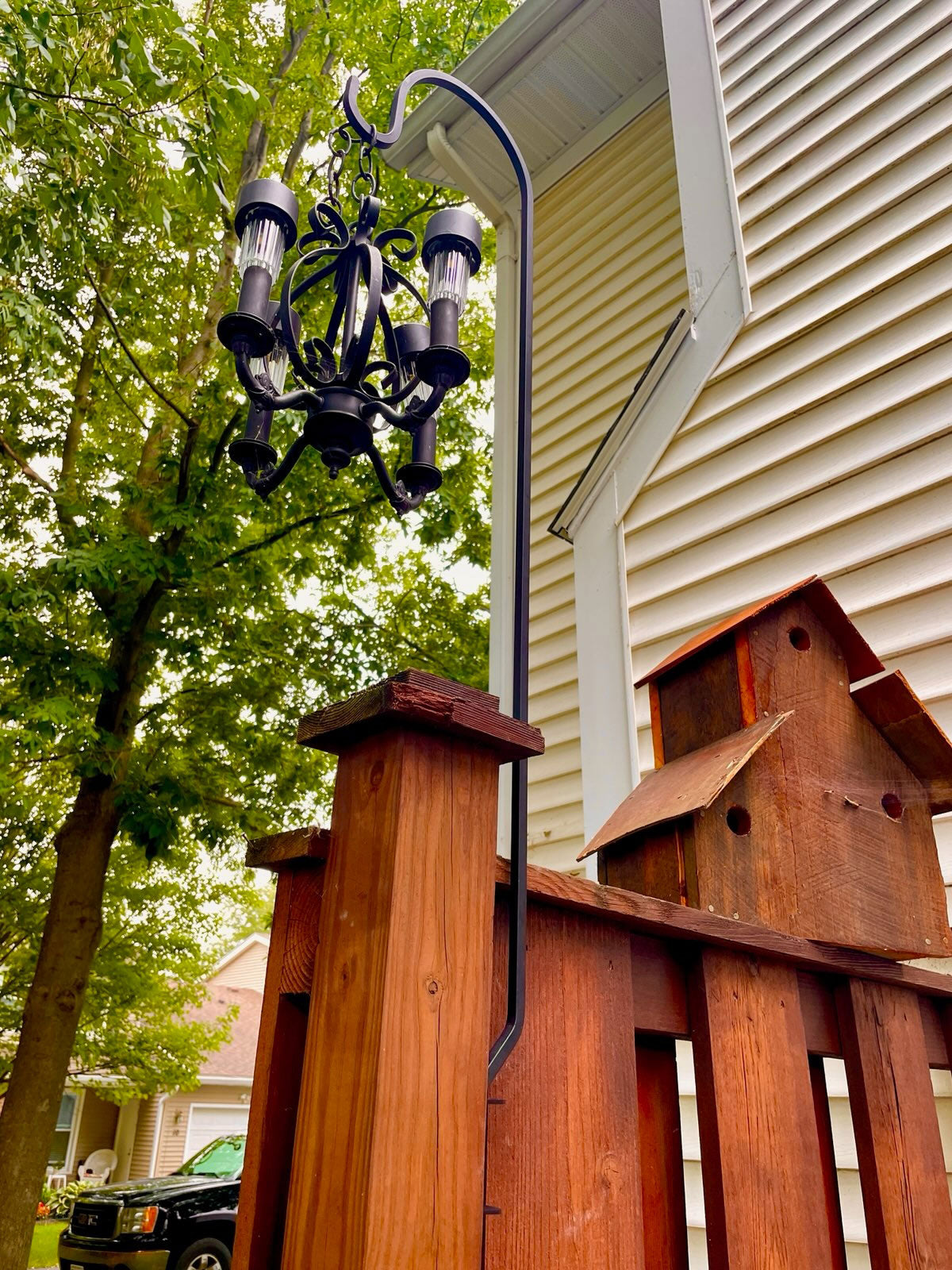 Deck mounting hook with lantern near house