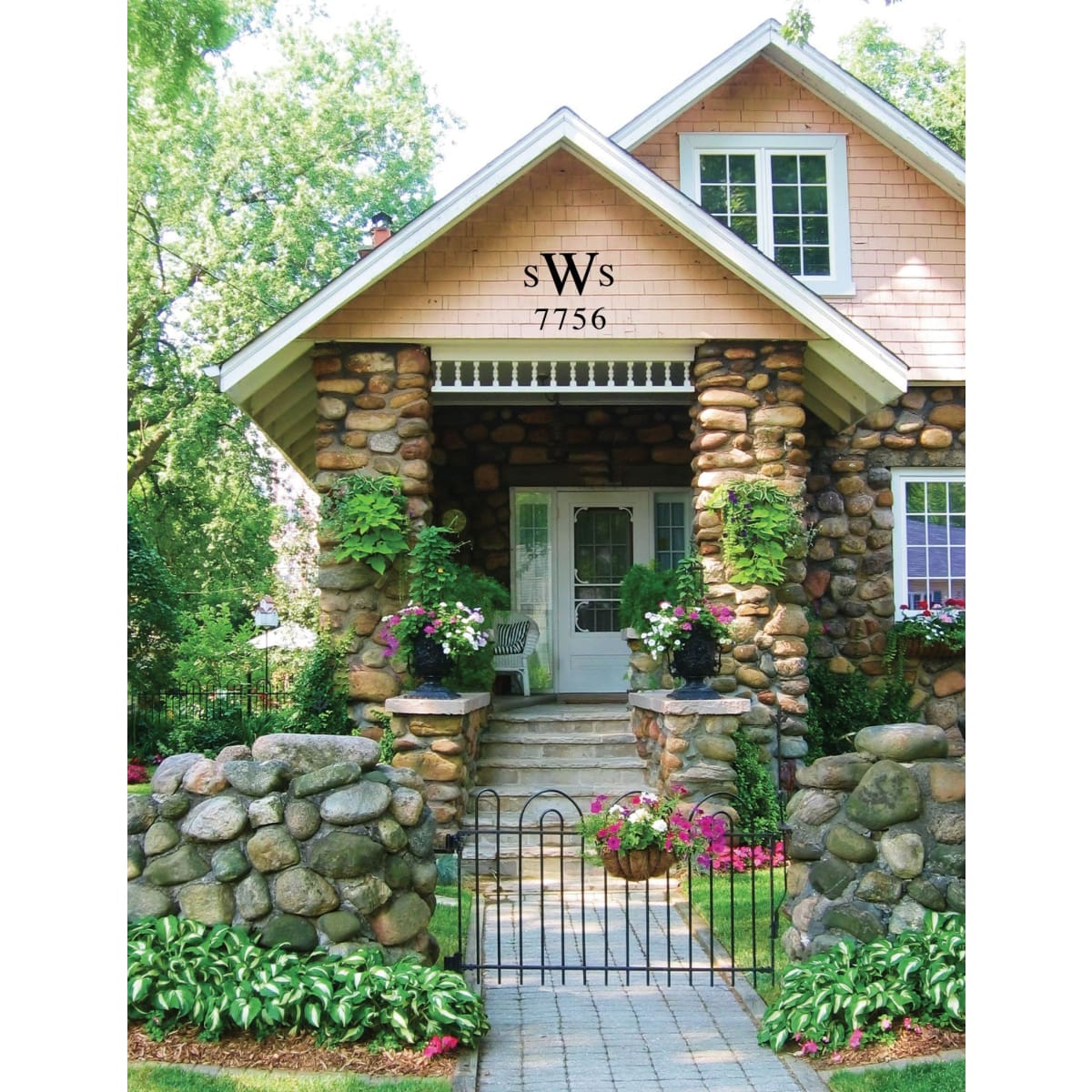 Charming stone house with decorative house letters and numbers