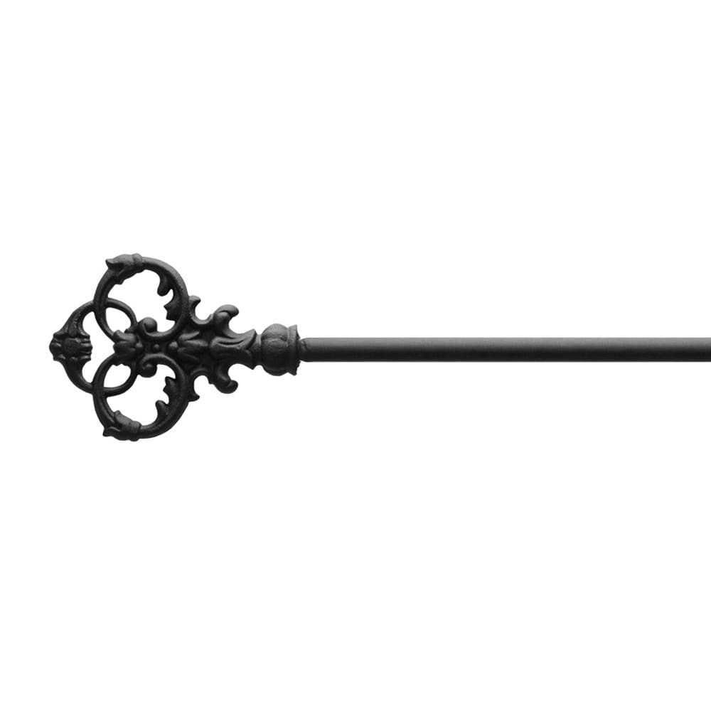 Close-up of Victorian key design on curtain rod